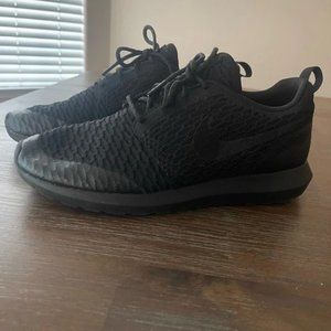 Woman’s Nike black running shoes size 8